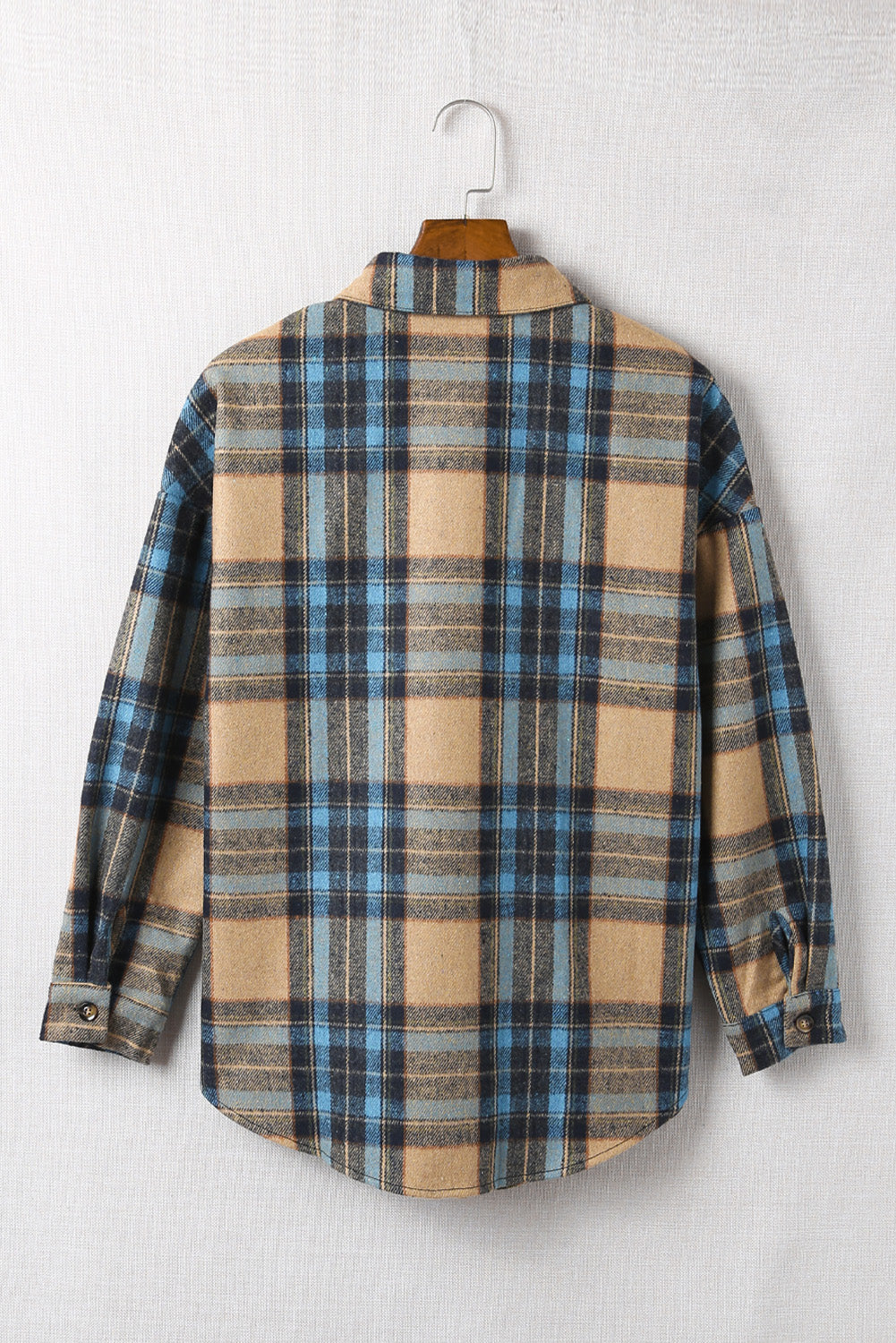 A stylish plaid color block buttoned shirt featuring functional pockets, perfect for fall fashion.