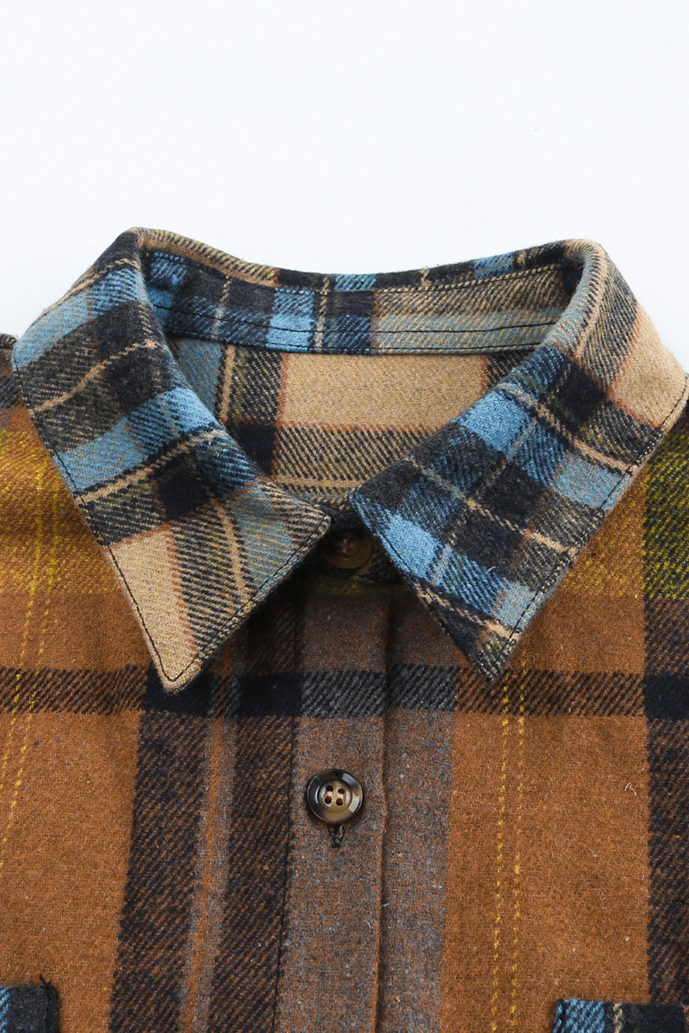 A stylish plaid color block buttoned shirt featuring functional pockets, perfect for fall fashion.