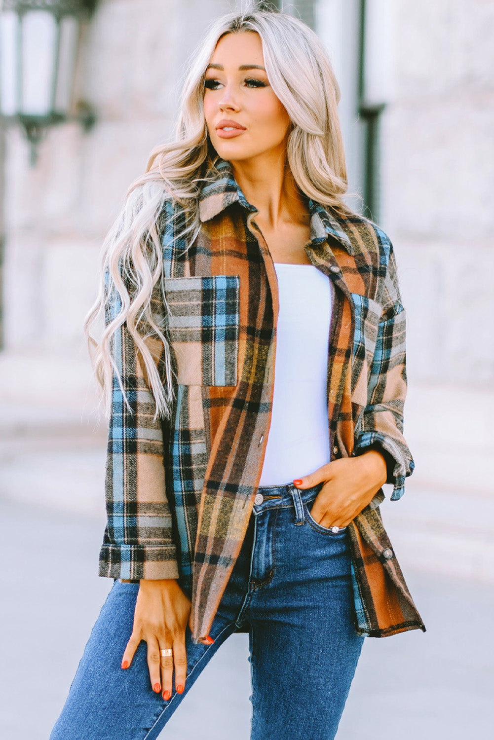 A stylish plaid color block buttoned shirt featuring functional pockets, perfect for fall fashion.