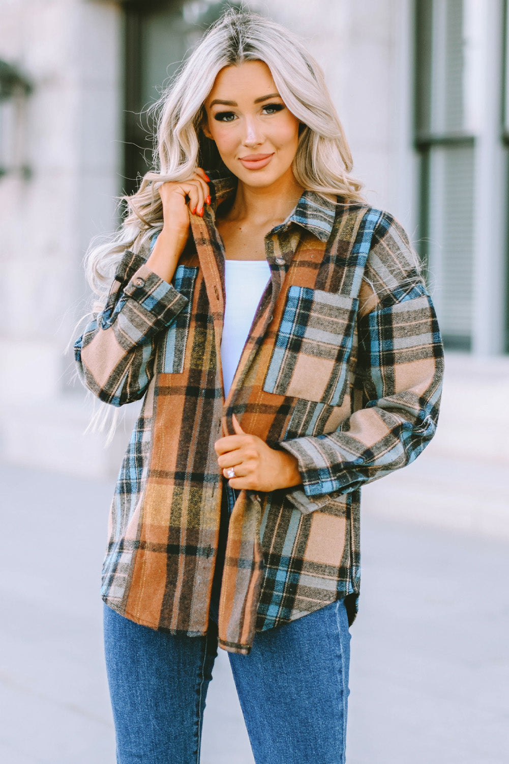 A stylish plaid color block buttoned shirt featuring functional pockets, perfect for fall fashion.