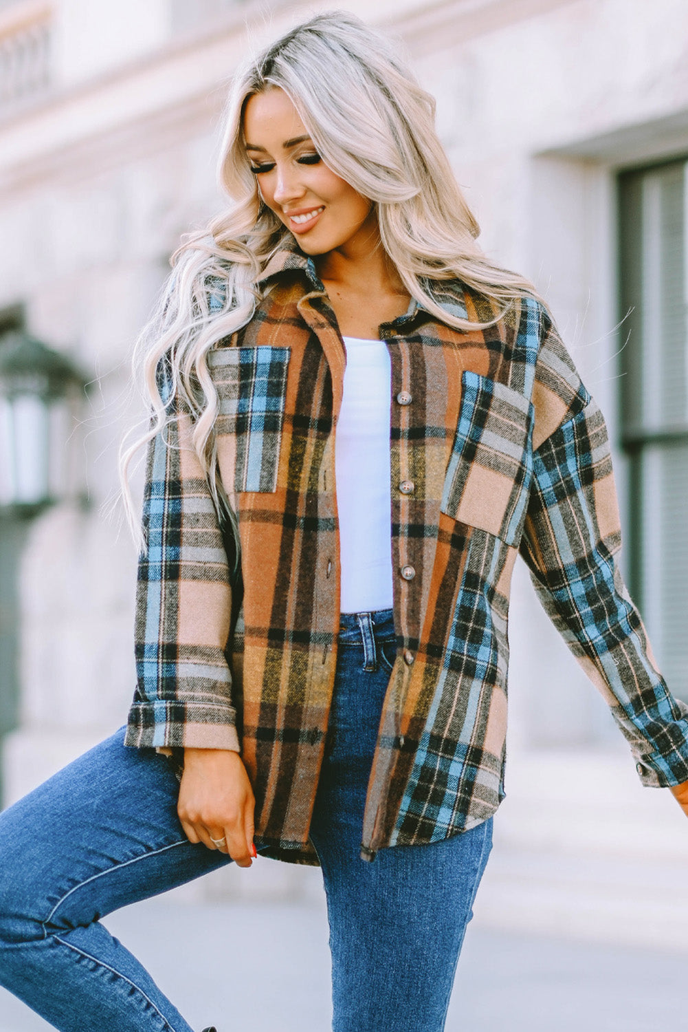 A stylish plaid color block buttoned shirt featuring functional pockets, perfect for fall fashion.