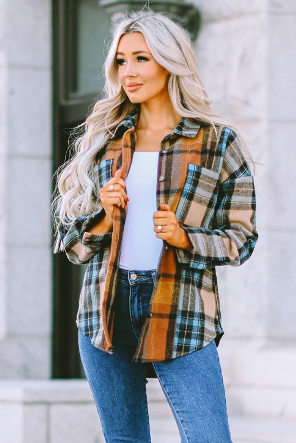 A stylish plaid color block buttoned shirt featuring functional pockets, perfect for fall fashion.