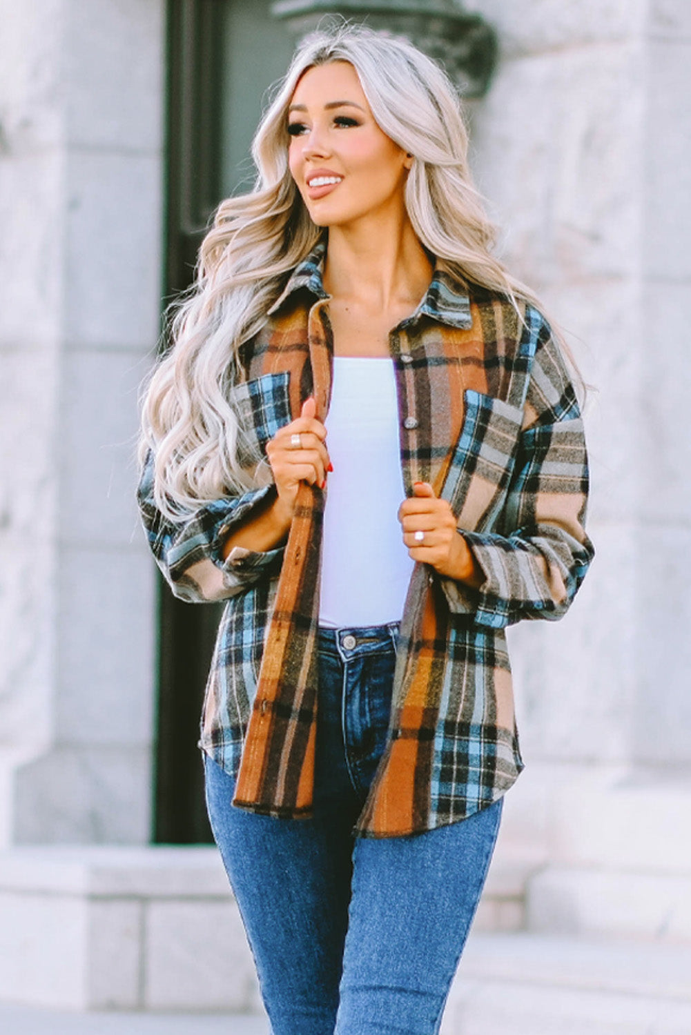 A stylish plaid color block buttoned shirt featuring functional pockets, perfect for fall fashion.