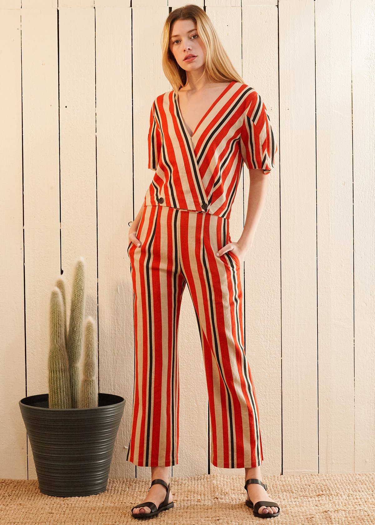 Puff Sleeve Wrap Blouse in Poppy Multi featuring gathered sleeves and a vibrant print, showcasing a stylish design suitable for various occasions.