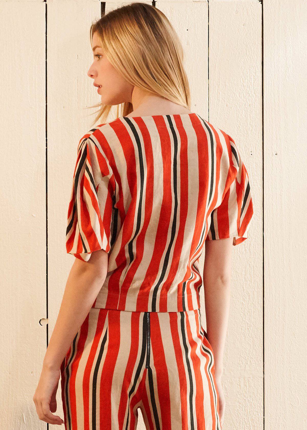 Puff Sleeve Wrap Blouse in Poppy Multi featuring gathered sleeves and a vibrant print, showcasing a stylish design suitable for various occasions.