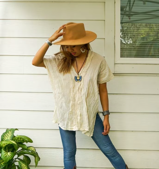 A stylish Raw Crinkled Cotton Gauze Blouse featuring 12 layers of sewn tucks, perfect for a bohemian look.