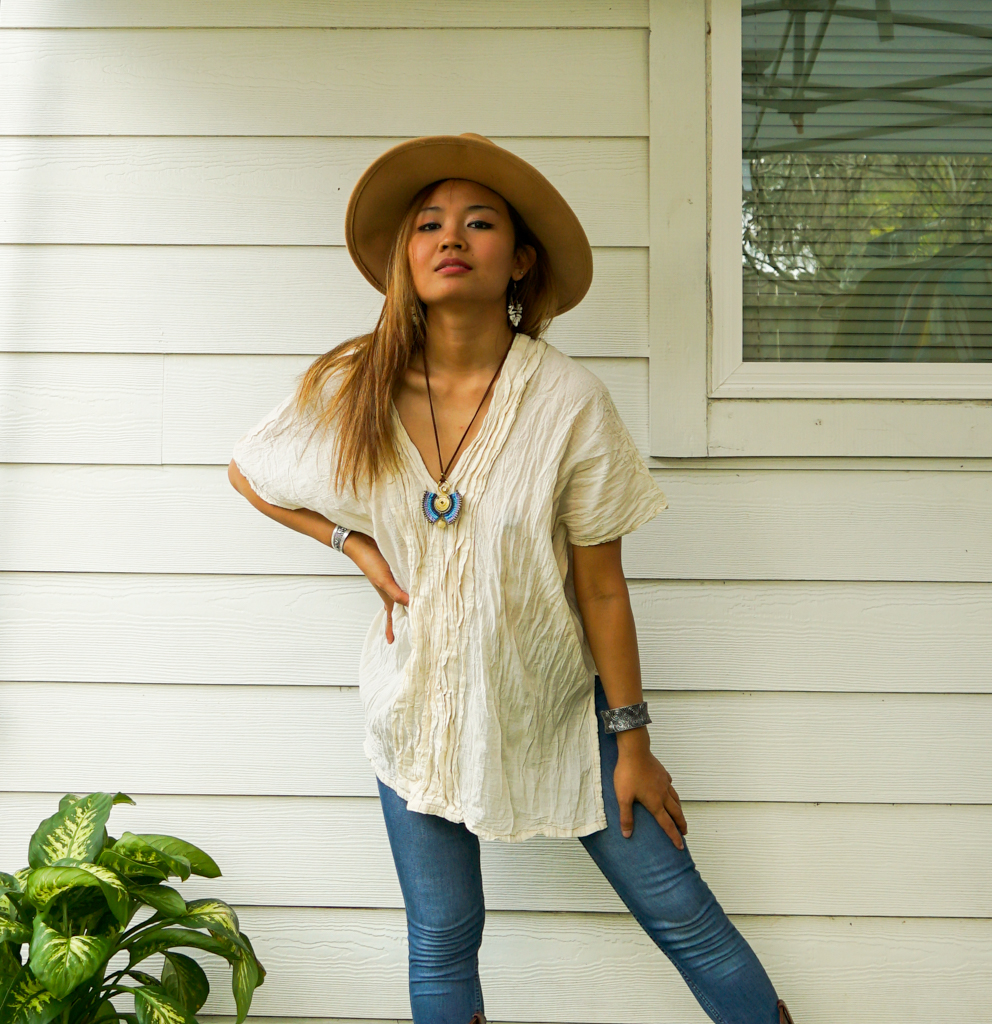 A stylish Raw Crinkled Cotton Gauze Blouse featuring 12 layers of sewn tucks, perfect for a bohemian look.