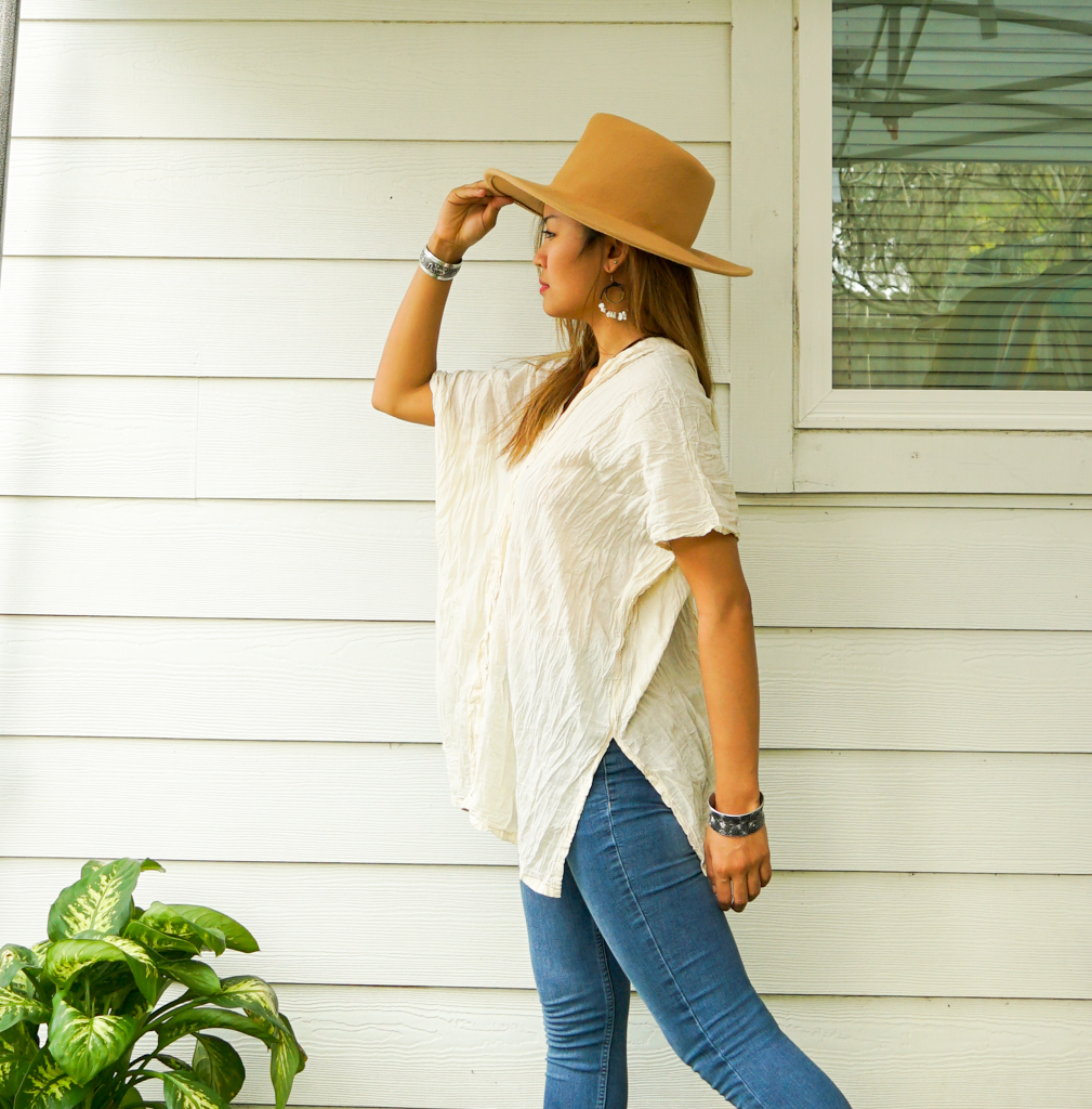 A stylish Raw Crinkled Cotton Gauze Blouse featuring 12 layers of sewn tucks, perfect for a bohemian look.