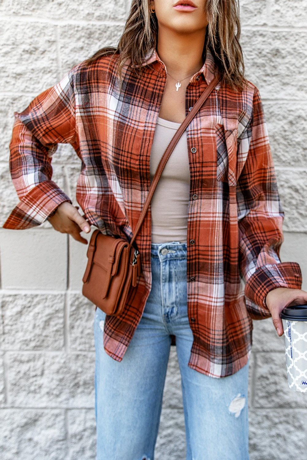 A stylish red plaid long sleeve shirt featuring a turn-down collar and button decoration, perfect for casual wear.