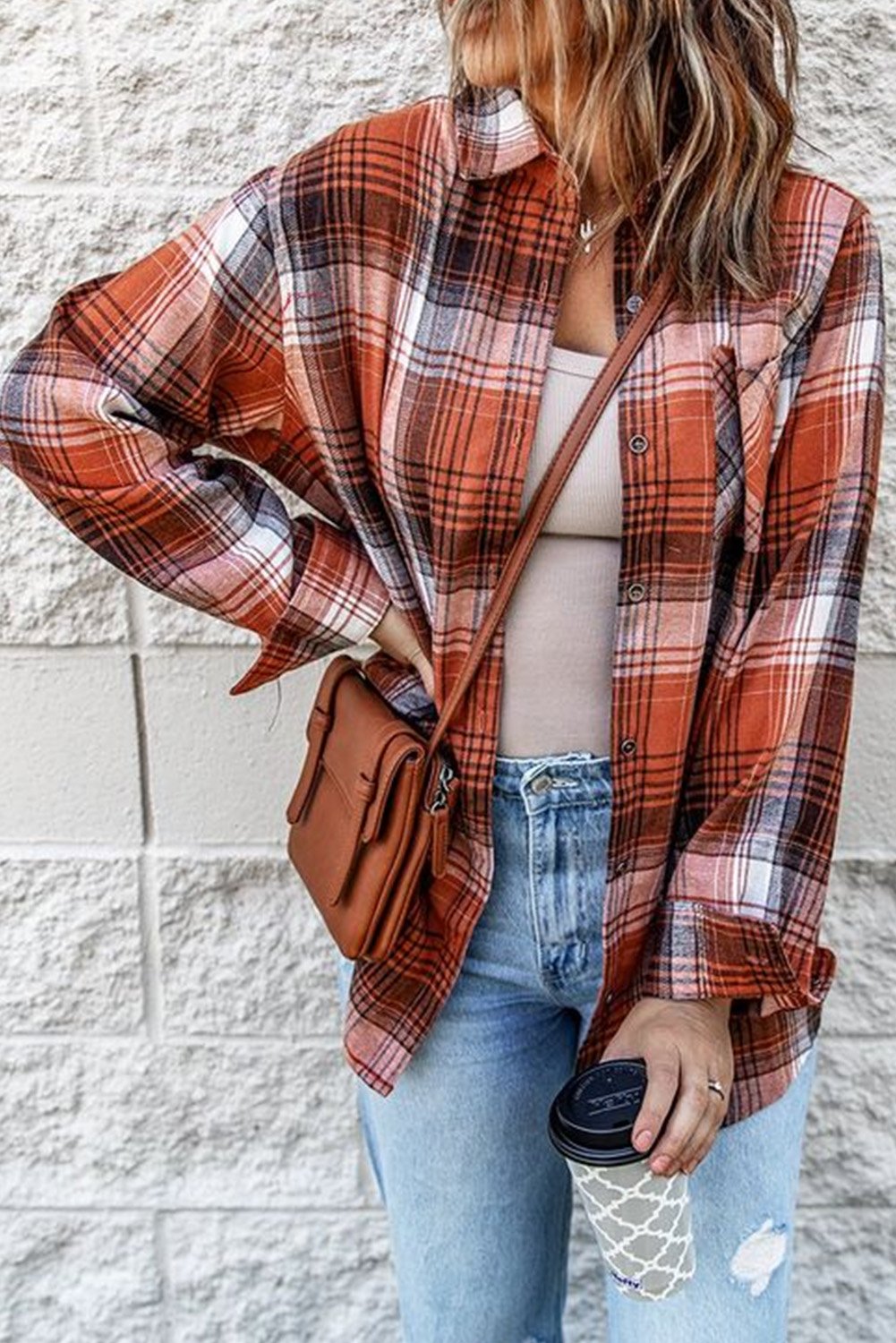 A stylish red plaid long sleeve shirt featuring a turn-down collar and button decoration, perfect for casual wear.