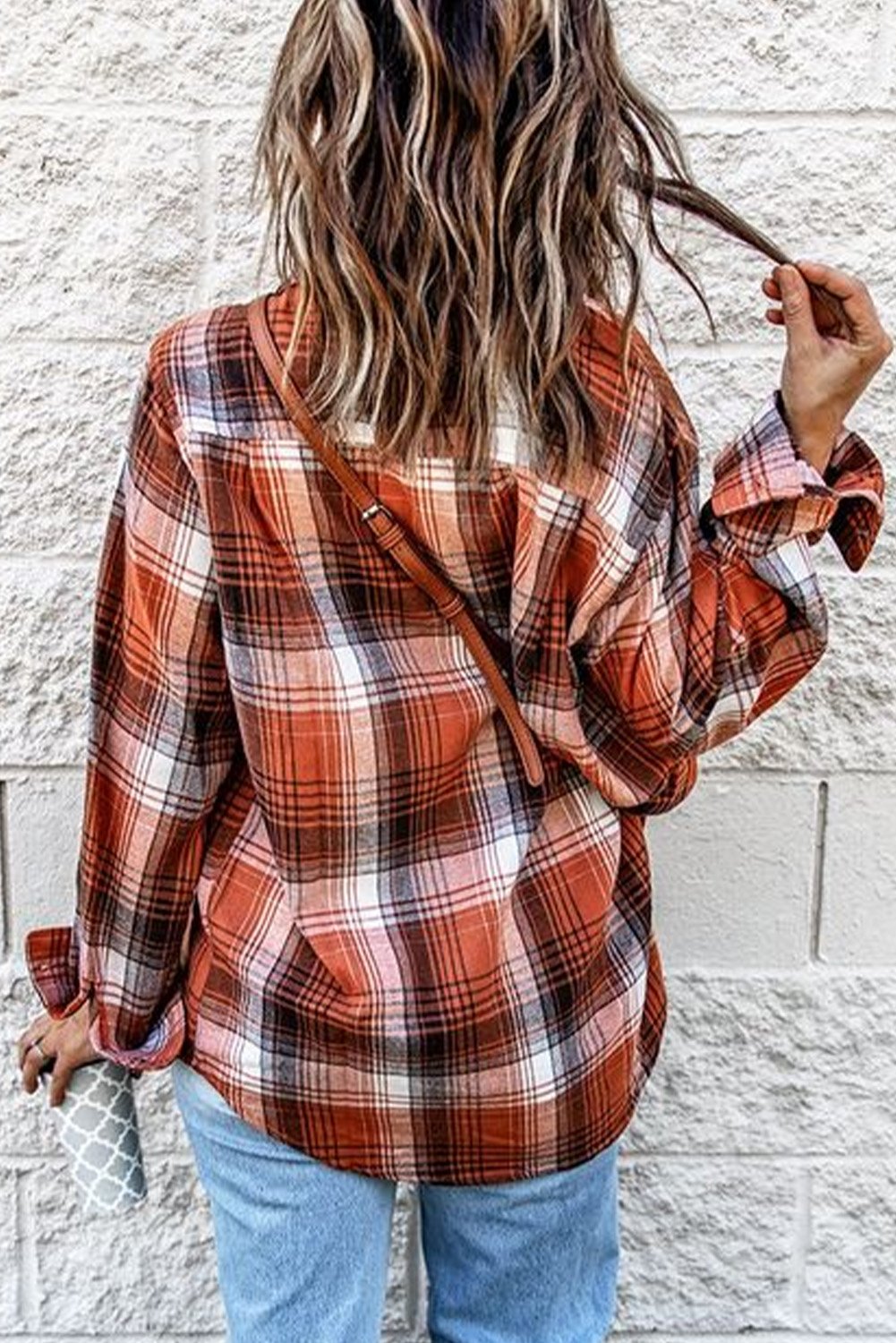 A stylish red plaid long sleeve shirt featuring a turn-down collar and button decoration, perfect for casual wear.