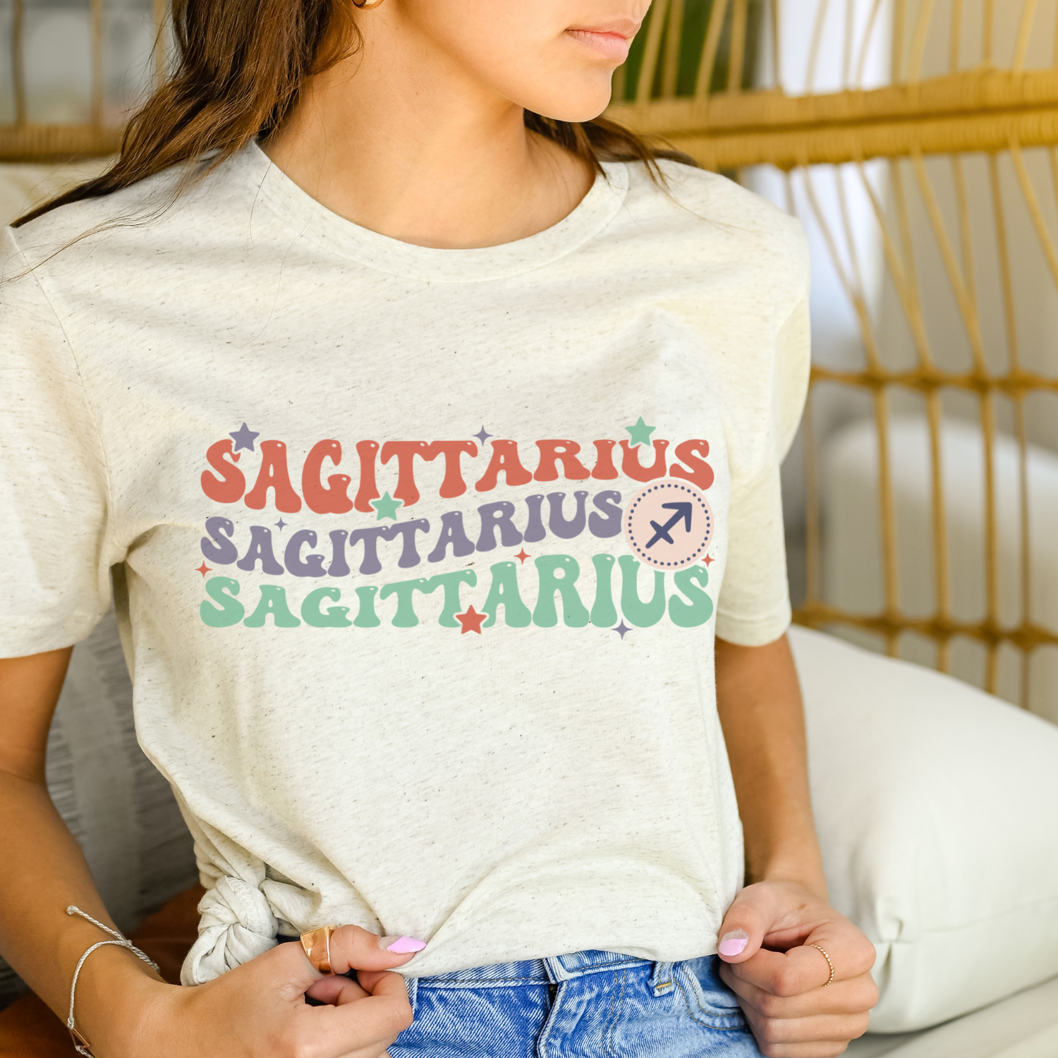 A soft tri-blend Retro Sagittarius Graphic Tee featuring a vintage design with astrological elements.