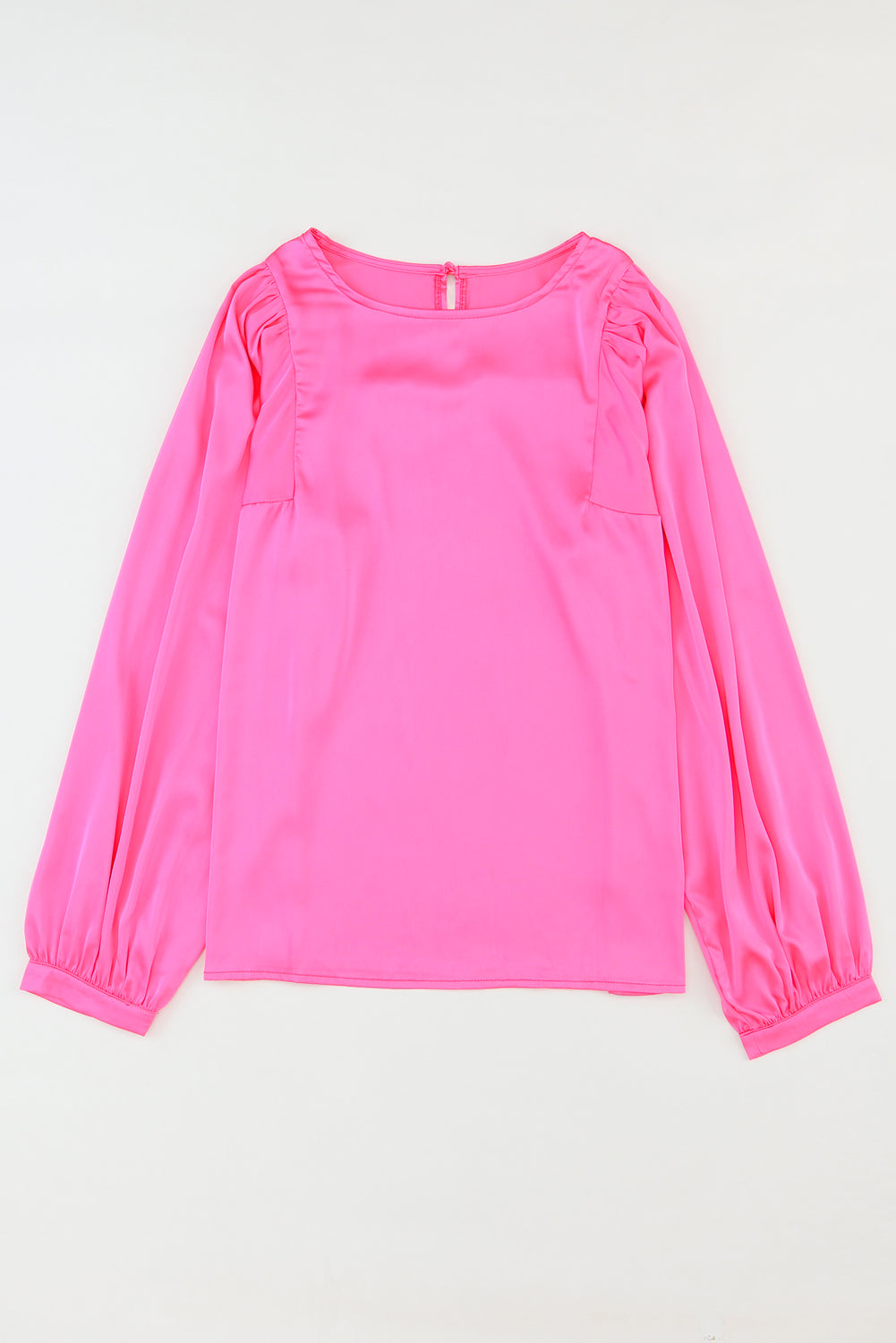 Elegant pink satin puff long sleeve crewneck blouse, showcasing a fitted design and sophisticated style.