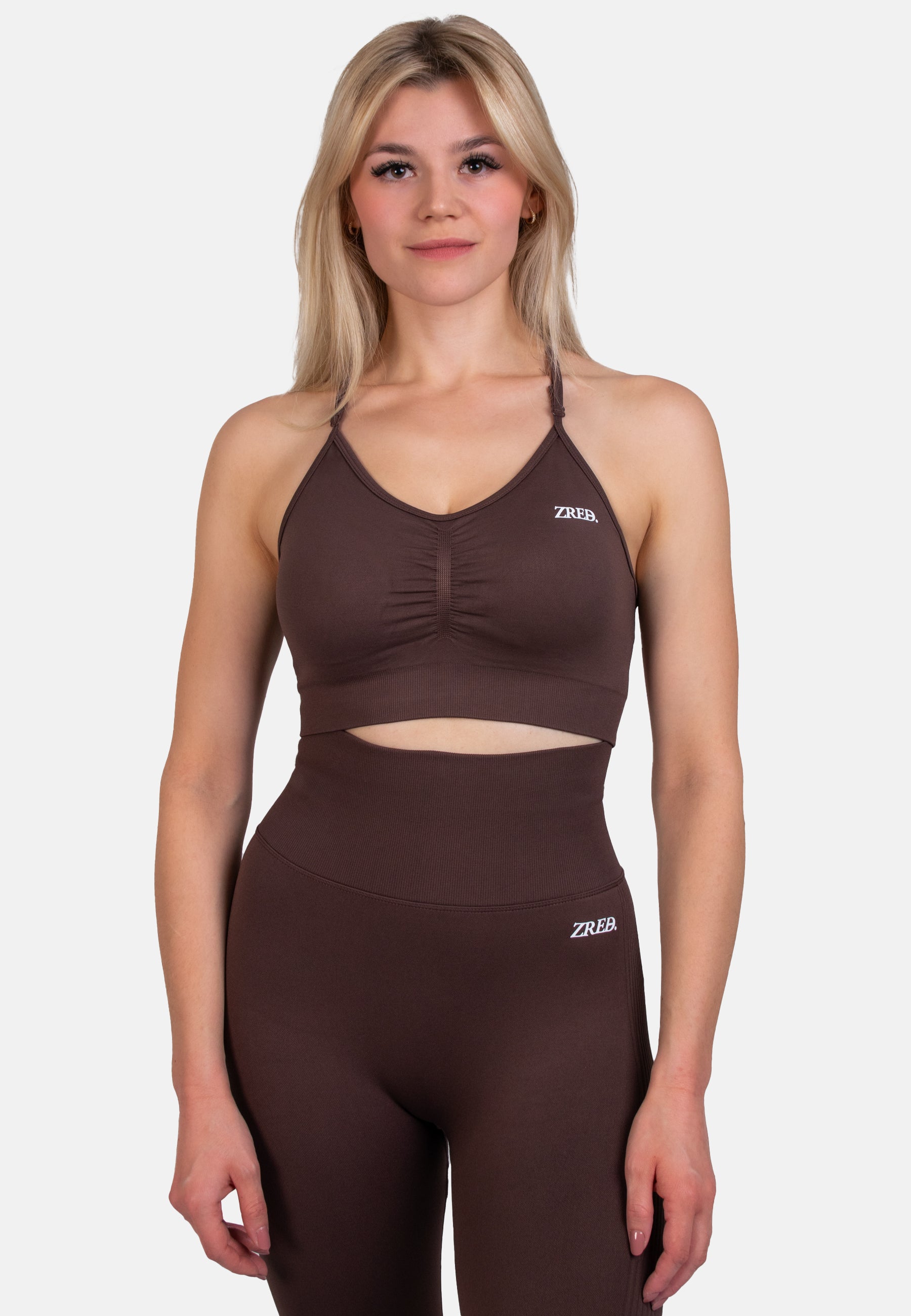 Shape Seamless Sports Bra in Schwarz, nahtloses Design mit verstellbaren Trägern und herausnehmbaren Pads, ideal für Sport und Alltag.