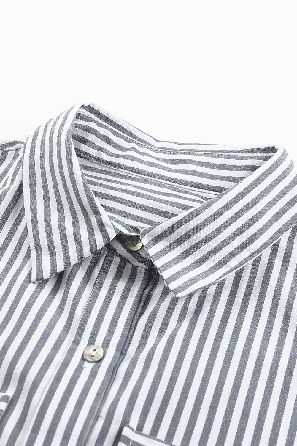 A stylish women's long sleeve shirt featuring a striped pattern, button-down front, and practical pockets, perfect for casual and formal occasions.