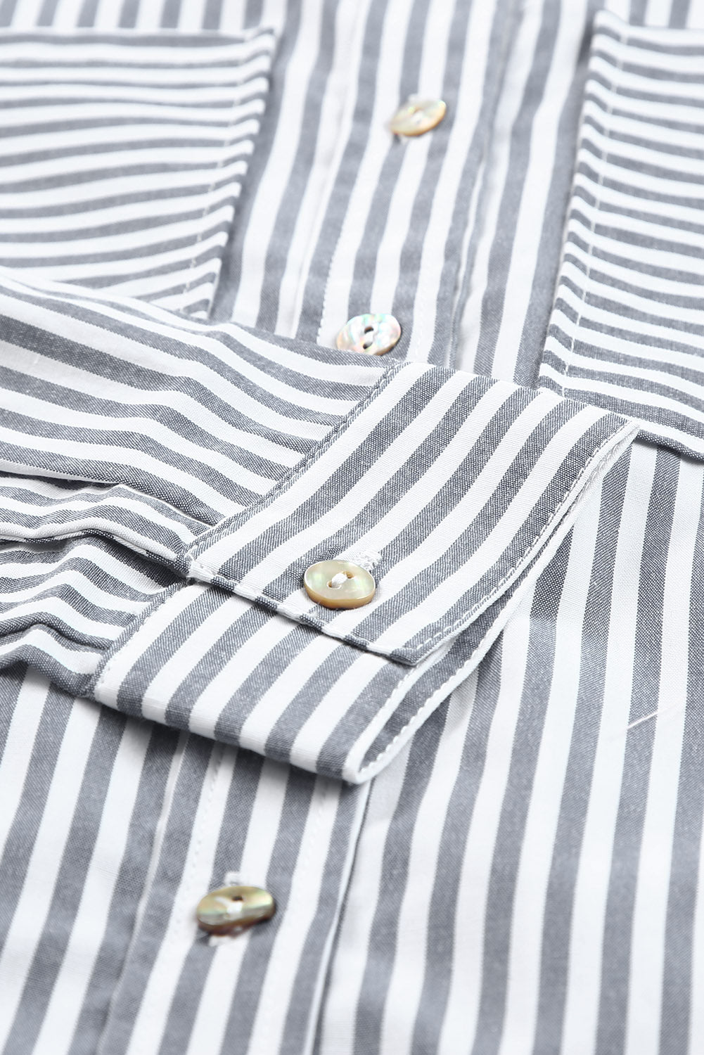 A stylish women's long sleeve shirt featuring a striped pattern, button-down front, and practical pockets, perfect for casual and formal occasions.