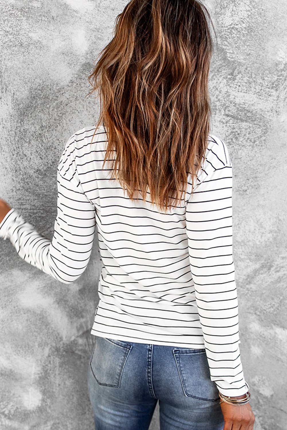 A stylish striped V neck long sleeve top in casual design, perfect for spring and autumn wear.