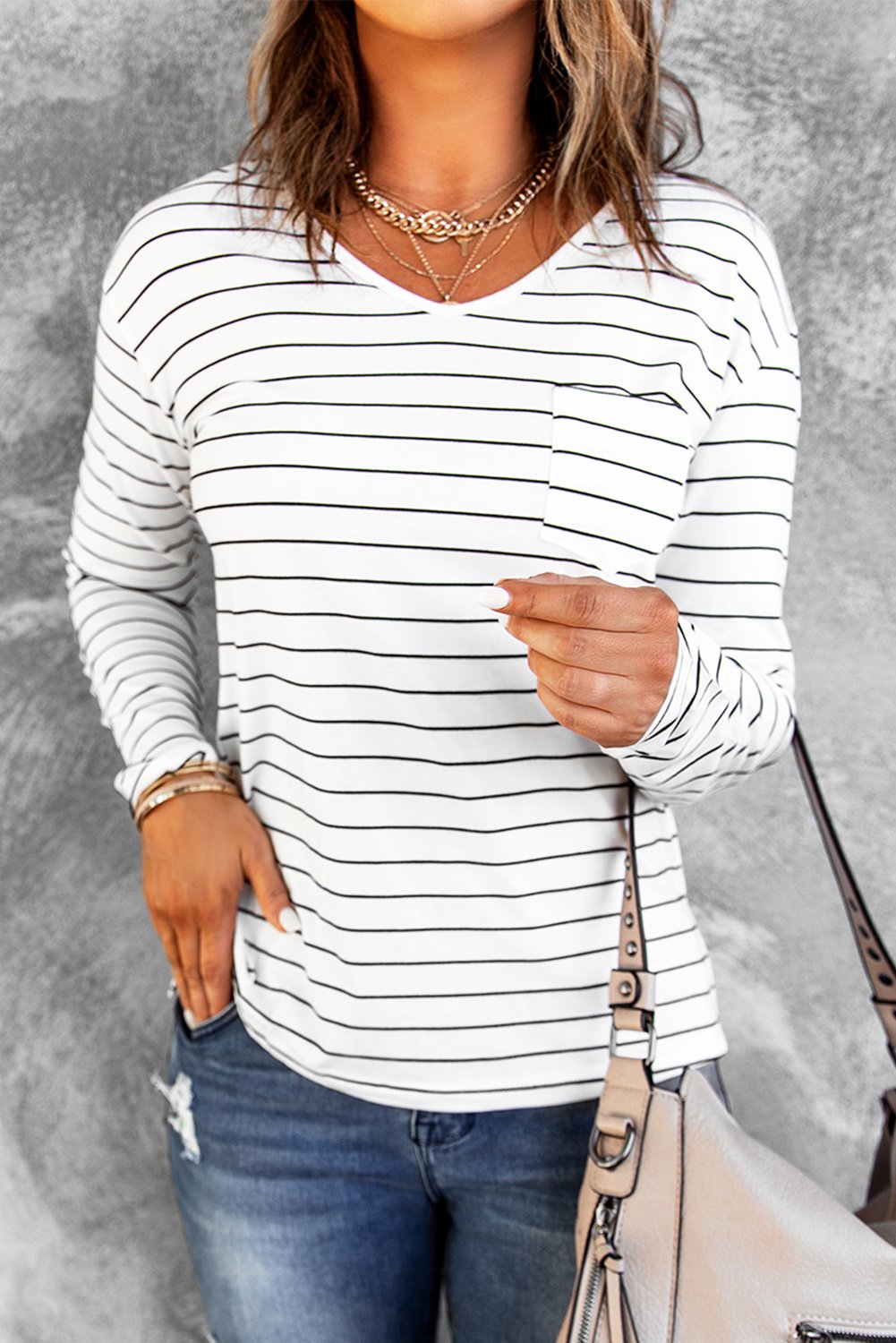 A stylish striped V neck long sleeve top in casual design, perfect for spring and autumn wear.