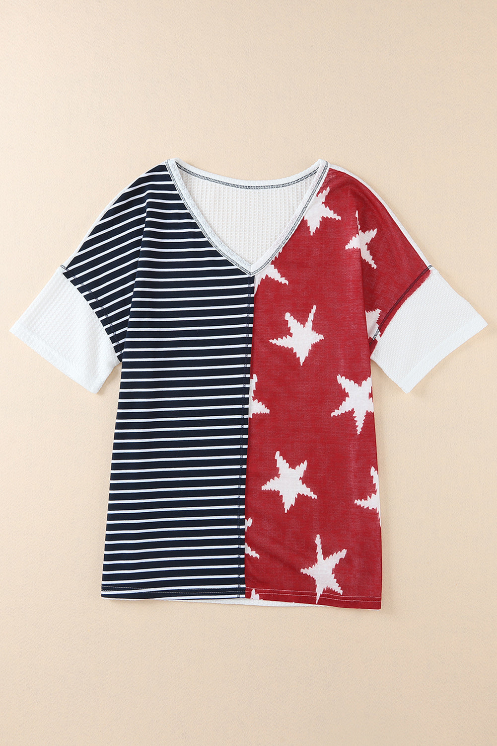 A stylish Stripes Stars Print Knit Top featuring bold stripes and star patterns, perfect for casual wear.