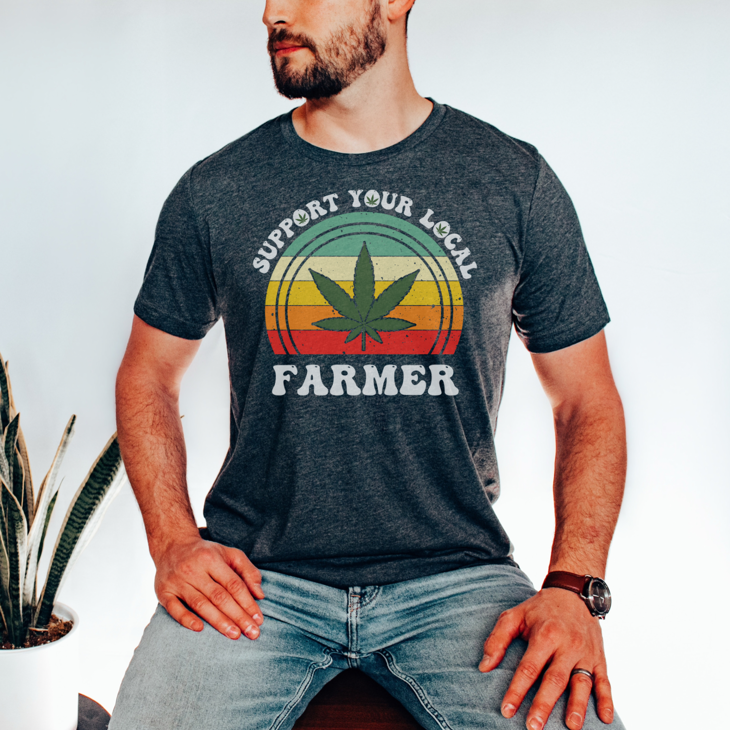 A soft graphic tee featuring the phrase 'Support Your Local Farmer' in bold letters, made from 100% ring spun cotton.