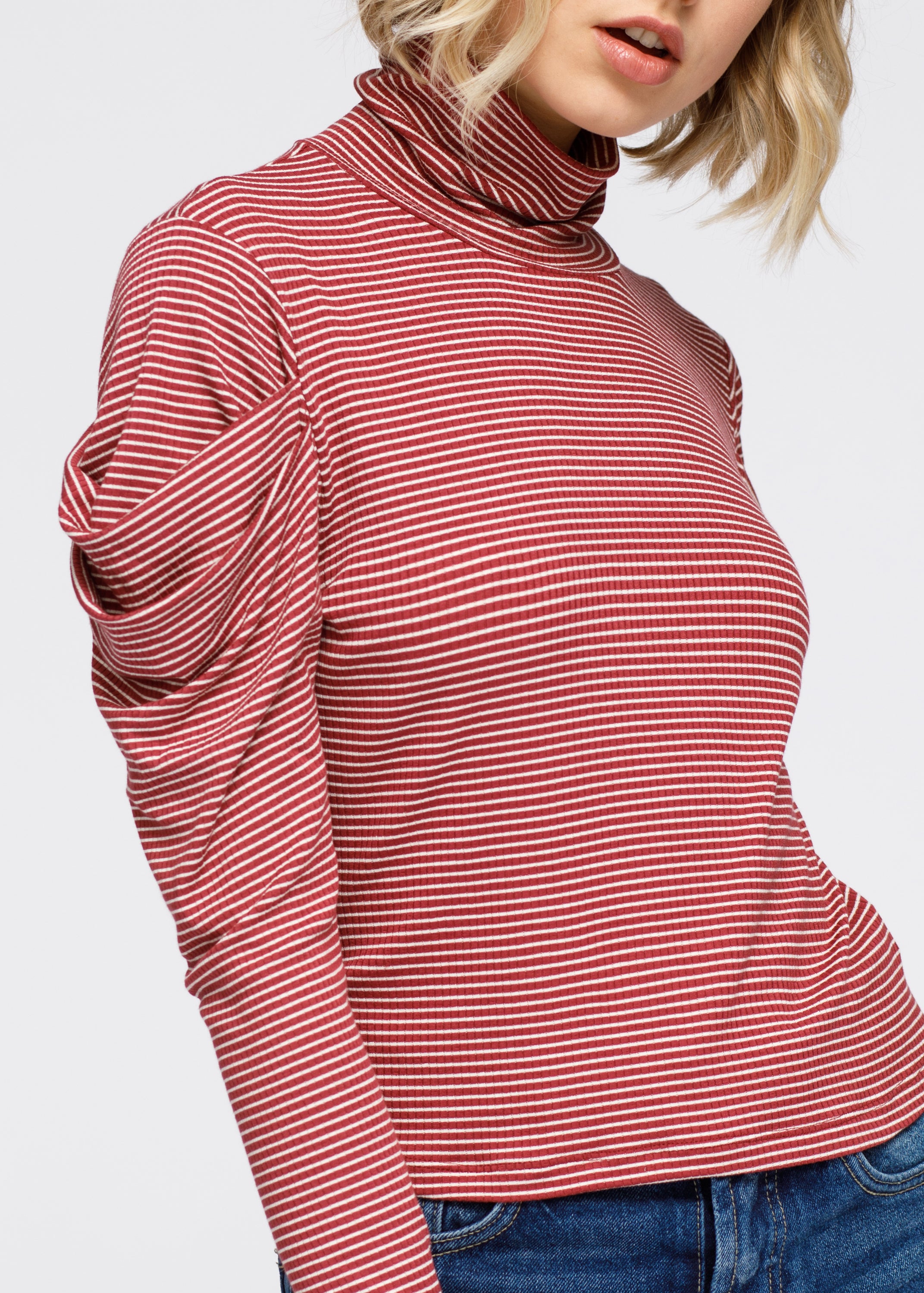 A stylish Turtle Neck Puff Sleeve Stripe Knit Top featuring a ribbed knit design, gathered puff sleeves, and a chic turtle neck.