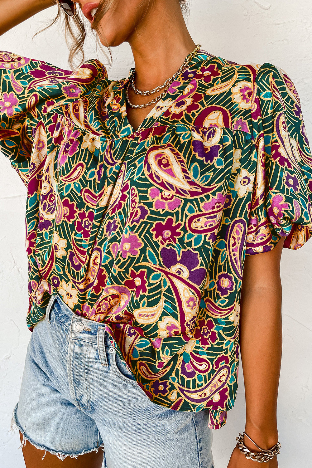 A stylish V Neck Short Bubble Sleeve Paisley Blouse featuring a vibrant paisley print, short bubble sleeves, and a loose fit, perfect for casual or formal wear.