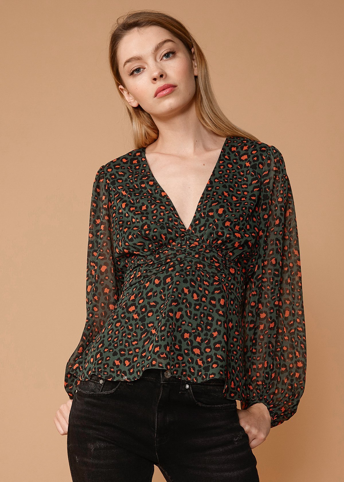 V-neck Puff Sleeve Blouse in Leopard Hunt featuring a stylish leopard print and smocked waist design.