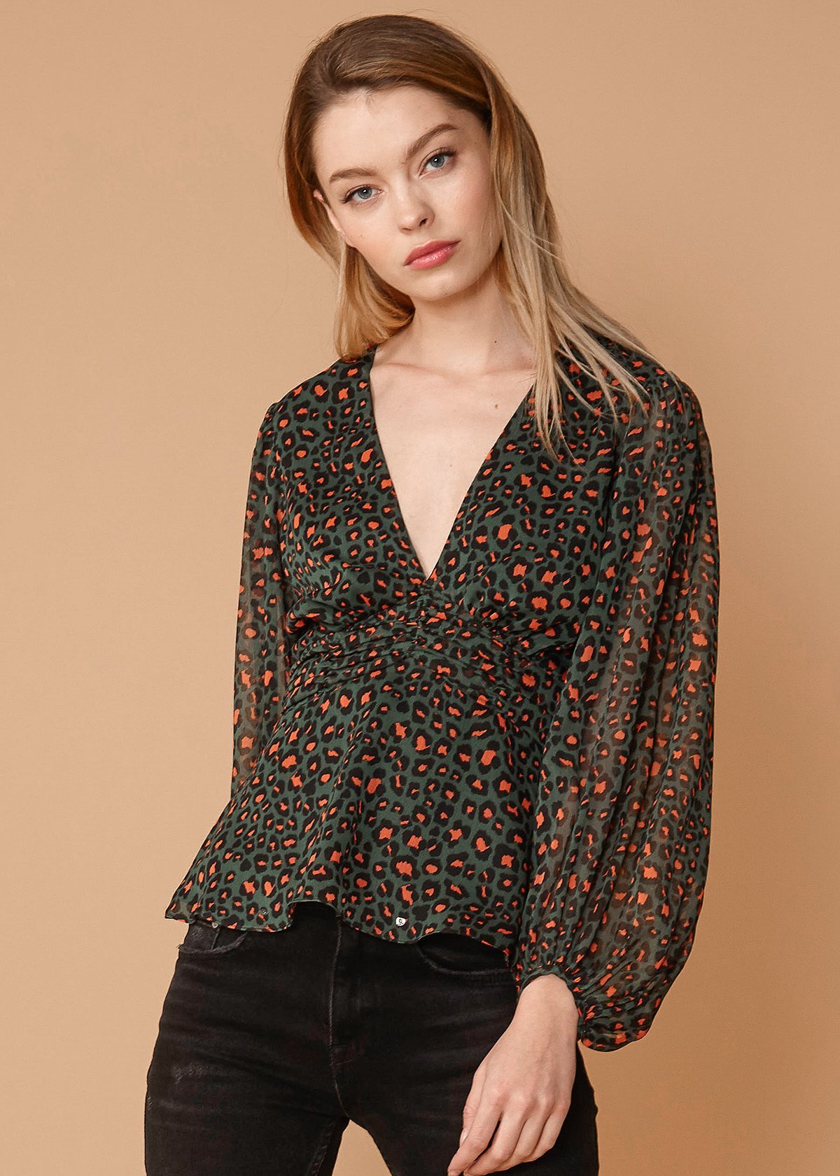 V-neck Puff Sleeve Blouse in Leopard Hunt featuring a stylish leopard print and smocked waist design.