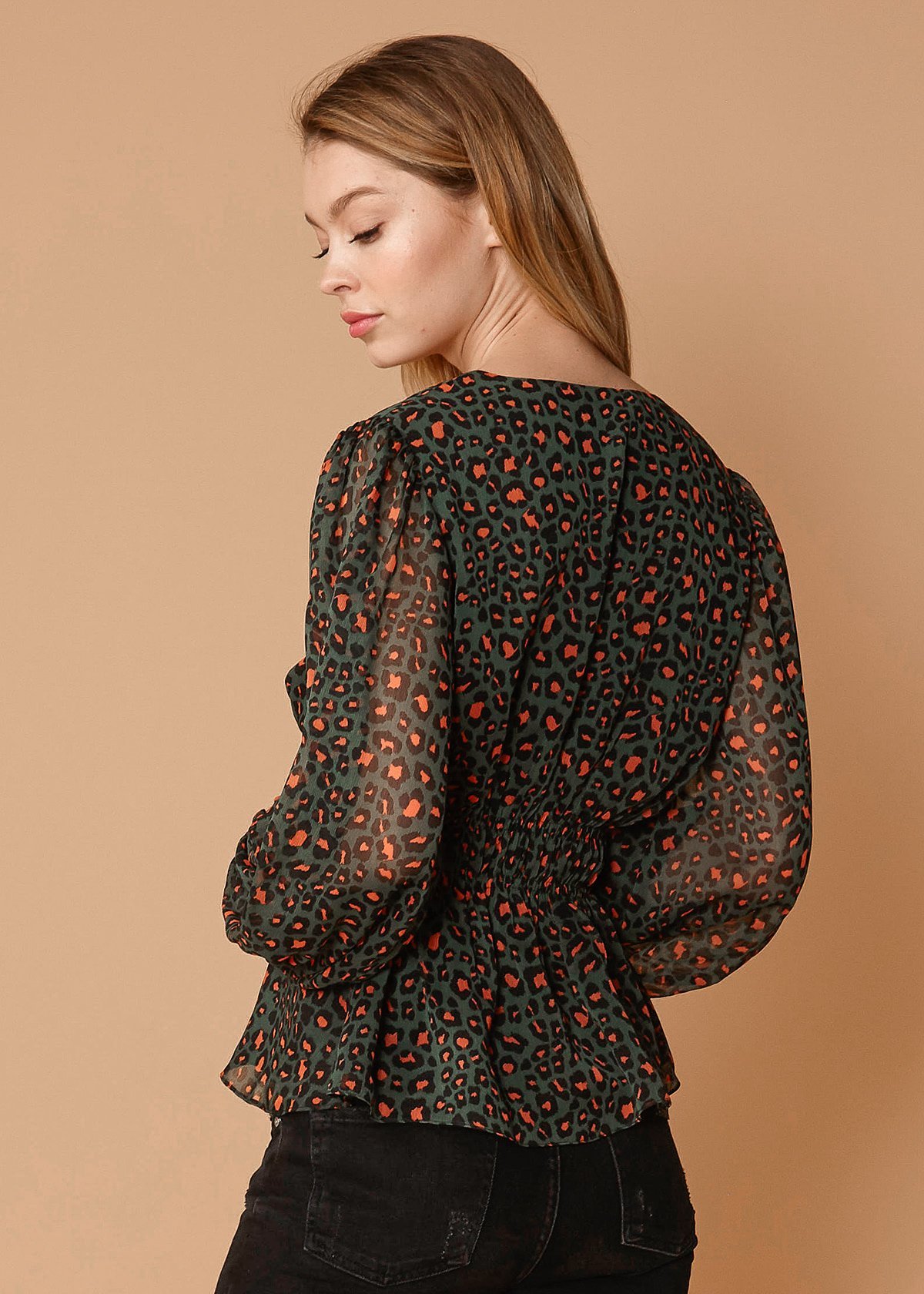 V-neck Puff Sleeve Blouse in Leopard Hunt featuring a stylish leopard print and smocked waist design.