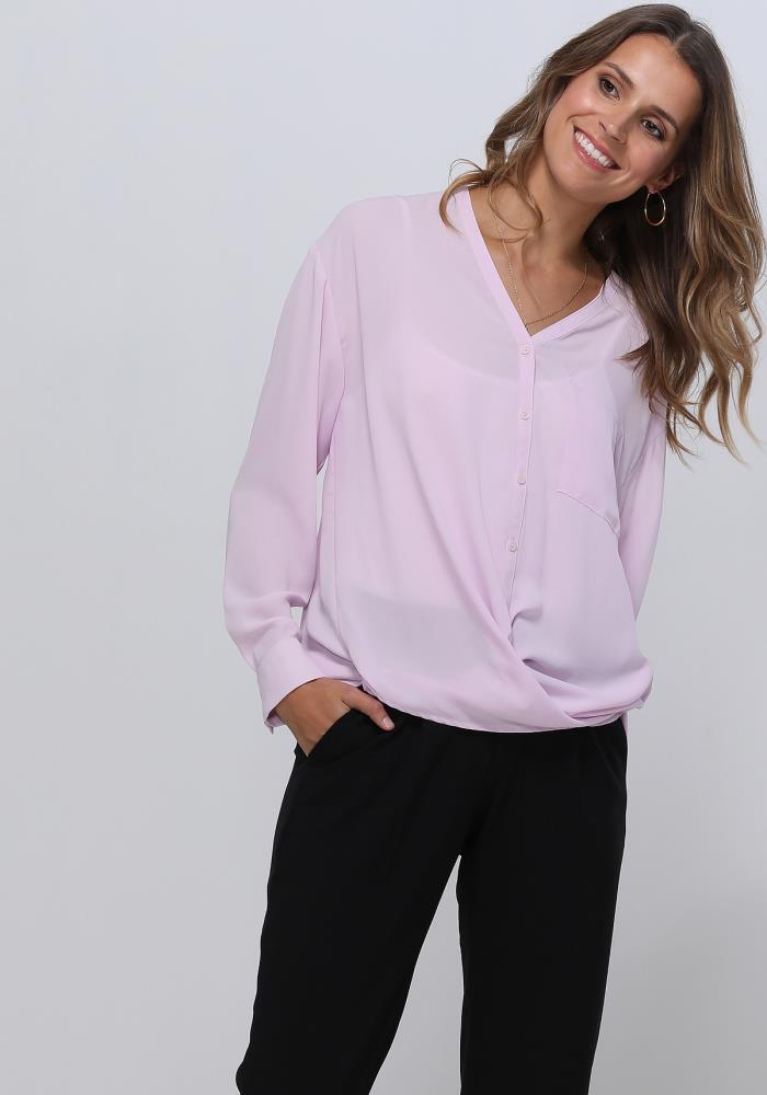 A stylish V-Neck Wrap Hem Blouse featuring a pleated front and hi-lo design, with long sleeves and single button cuffs, made from 100% polyester.