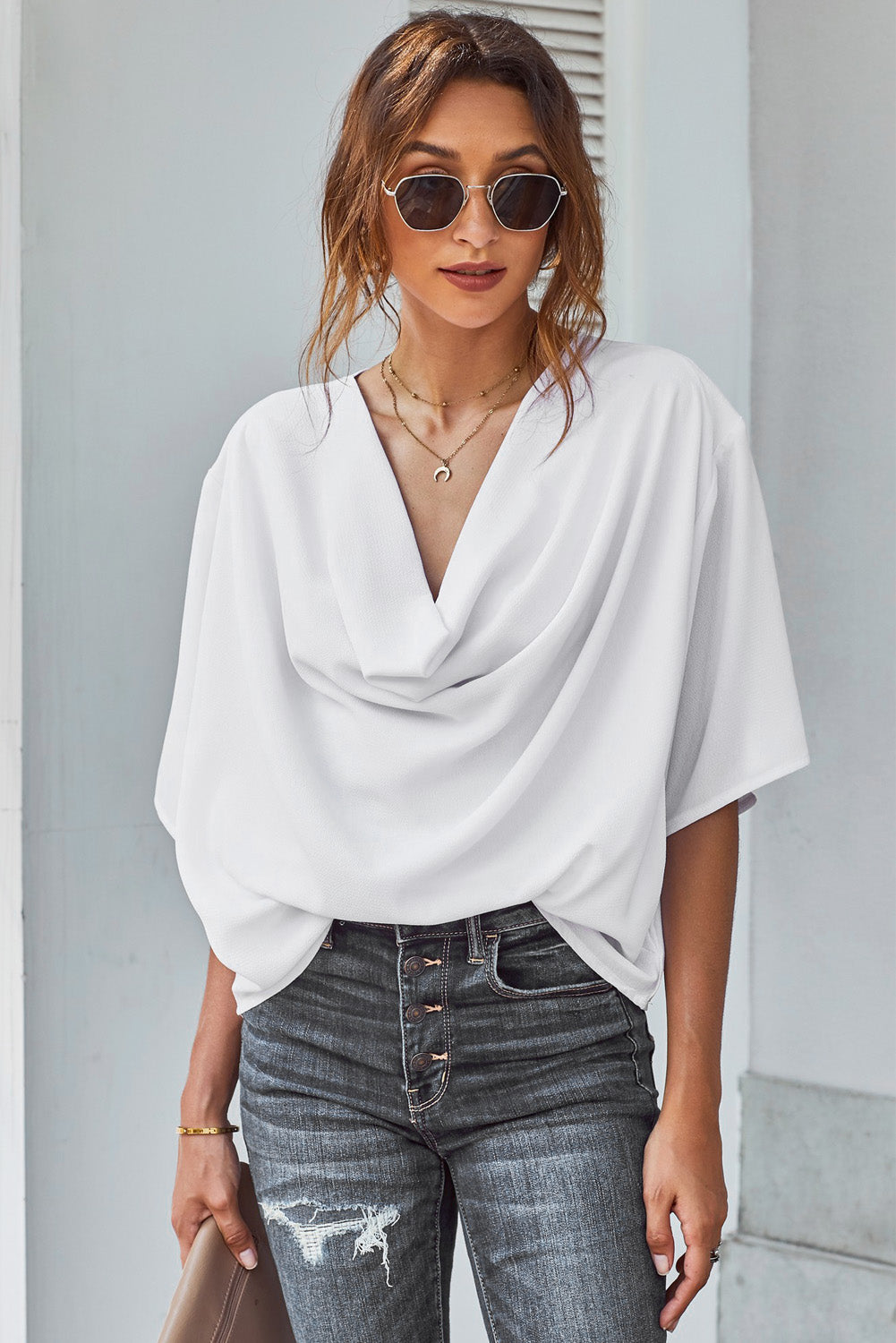 White draped short sleeve chic blouse with a loose front design, perfect for casual and semi-formal occasions.