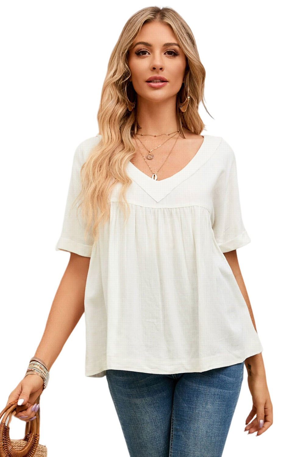 A stylish white babydoll blouse featuring frayed details, ruffled design, and rolled short sleeves, perfect for spring and summer wear.