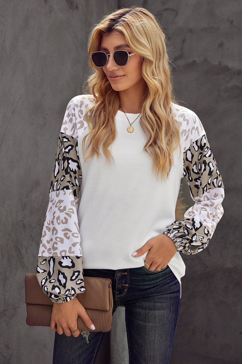 Women wearing a beige leopard print bubble sleeve top, showcasing its trendy design and comfortable fit.