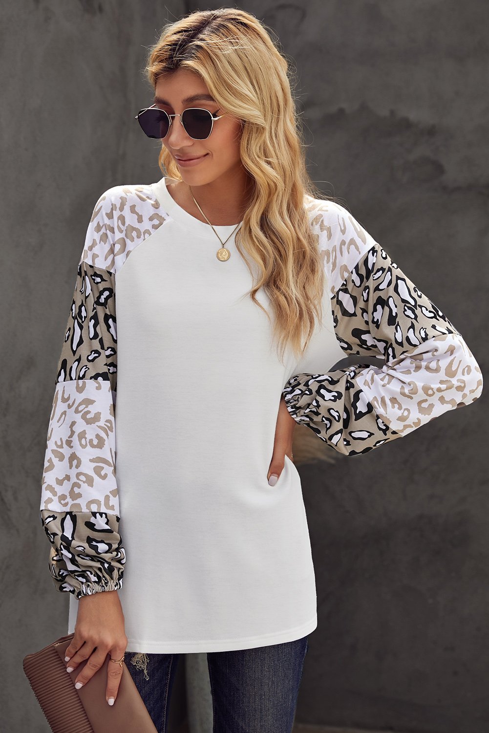 Women wearing a beige leopard print bubble sleeve top, showcasing its trendy design and comfortable fit.