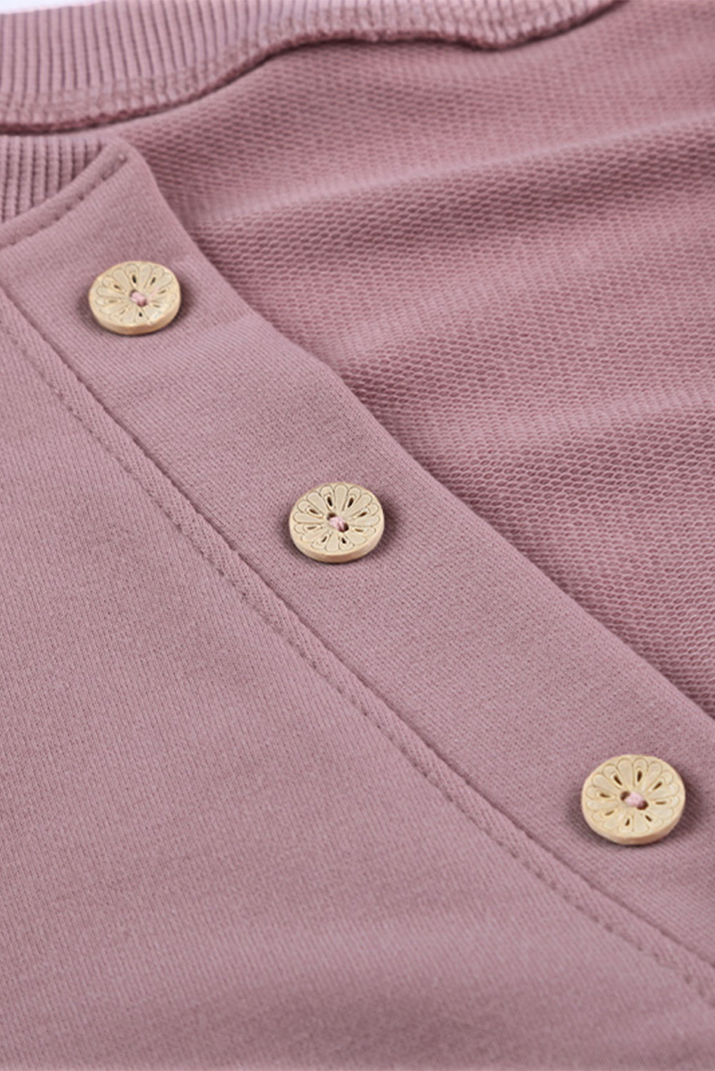 Women wearing a pink buttoned V neck cotton loose fit top, showcasing its stylish design and casual fit.