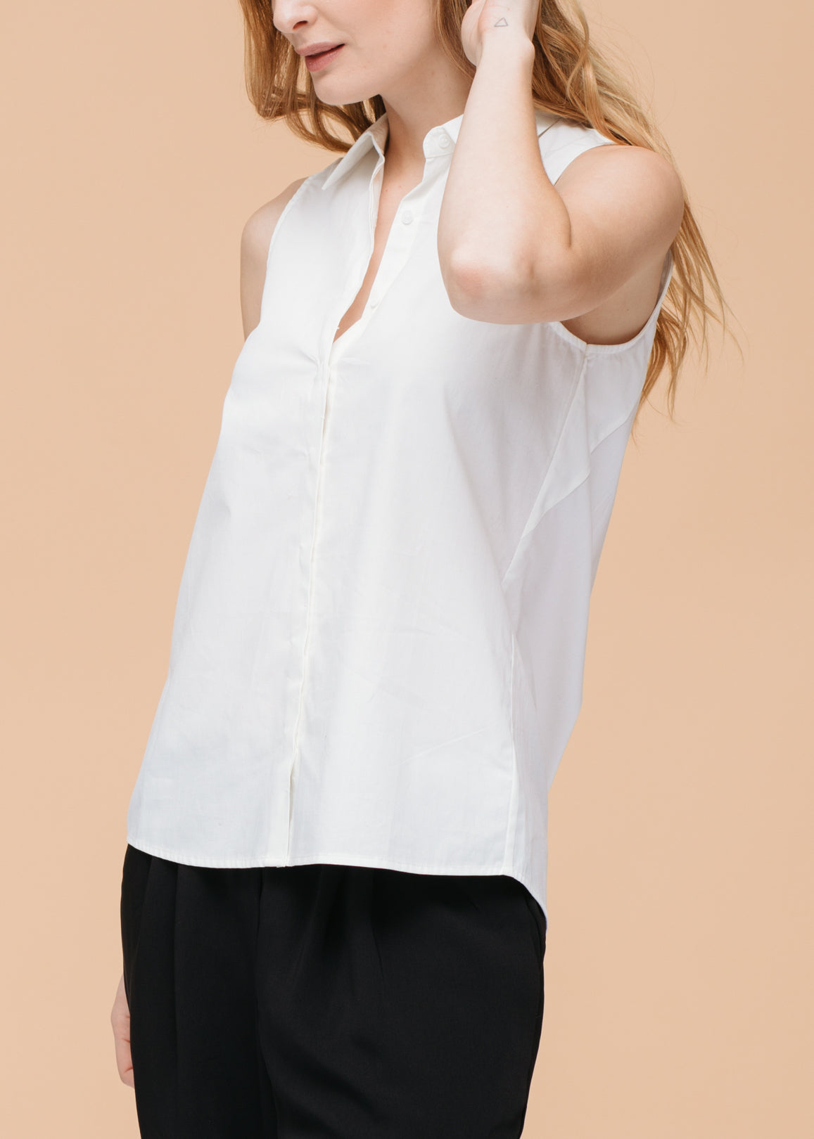 Women's Basic Sleeveless Poplin Shirt in White, showcasing a casual and stylish design made from 100% cotton.