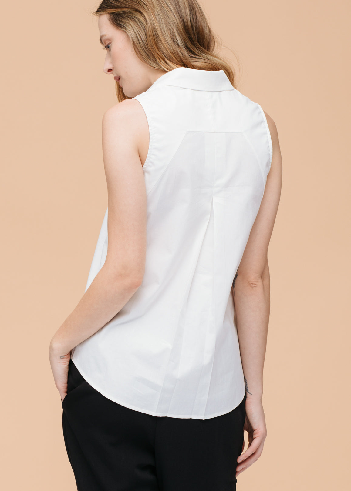 Women's Basic Sleeveless Poplin Shirt in White, showcasing a casual and stylish design made from 100% cotton.