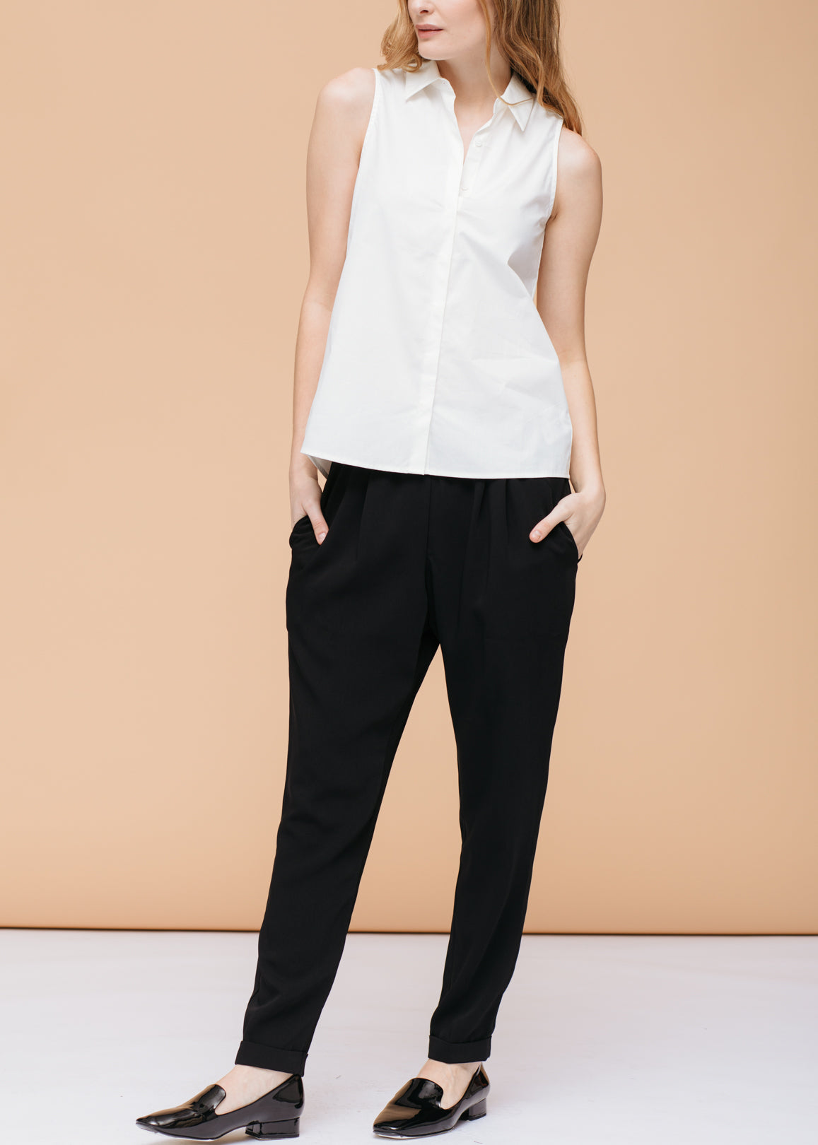 Women's Basic Sleeveless Poplin Shirt in White, showcasing a casual and stylish design made from 100% cotton.