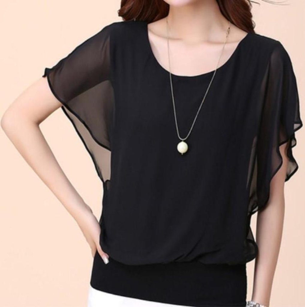 Woman wearing black chiffon blouse.