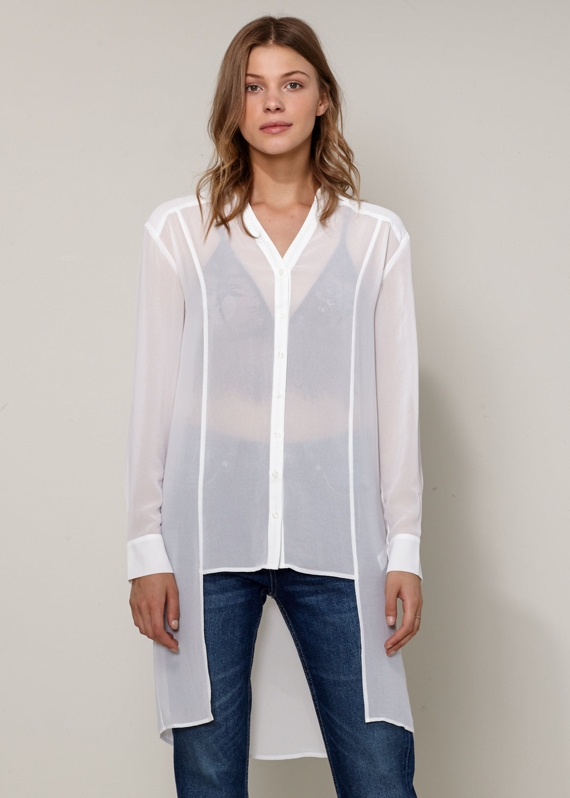 Women's Casual Sheer Hi-Lo Blouse featuring O-ring accent and hi-lo hem design, made from 100% polyester.