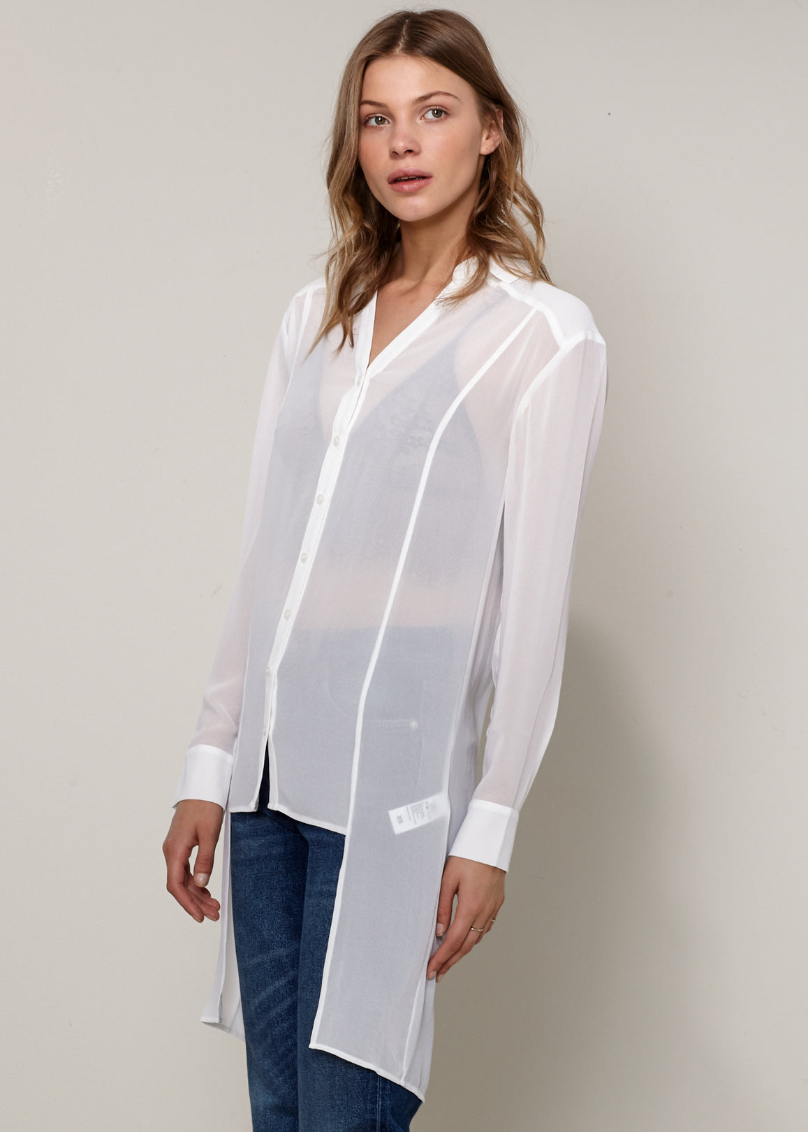 Women's Casual Sheer Hi-Lo Blouse featuring O-ring accent and hi-lo hem design, made from 100% polyester.