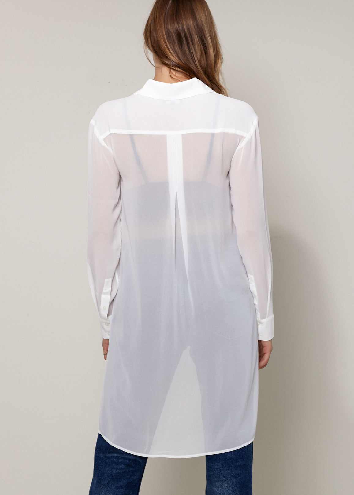 Women's Casual Sheer Hi-Lo Blouse featuring O-ring accent and hi-lo hem design, made from 100% polyester.