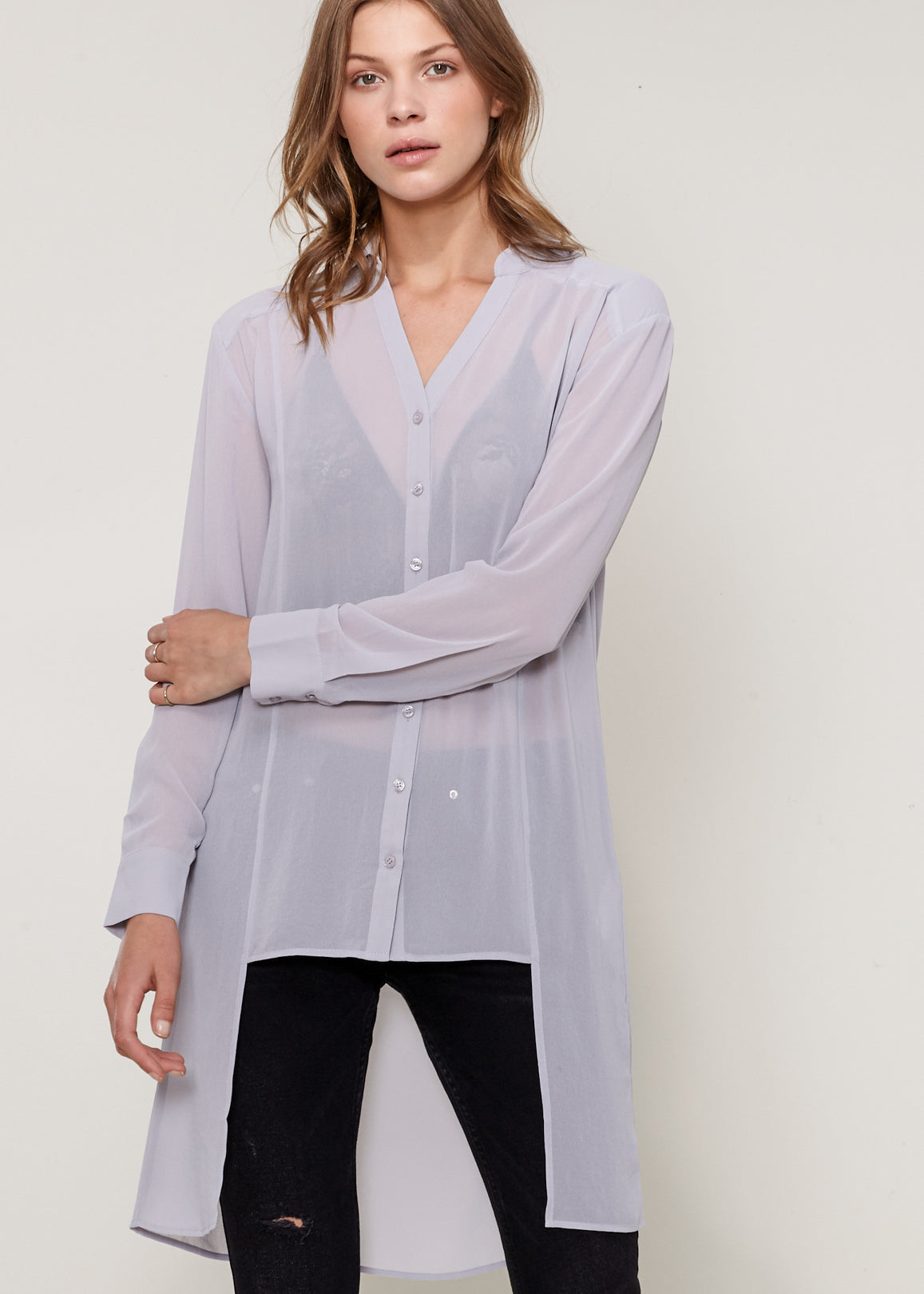 Women's Casual Sheer Hi-Lo Blouse featuring O-ring accent and hi-lo hem design, made from 100% polyester.