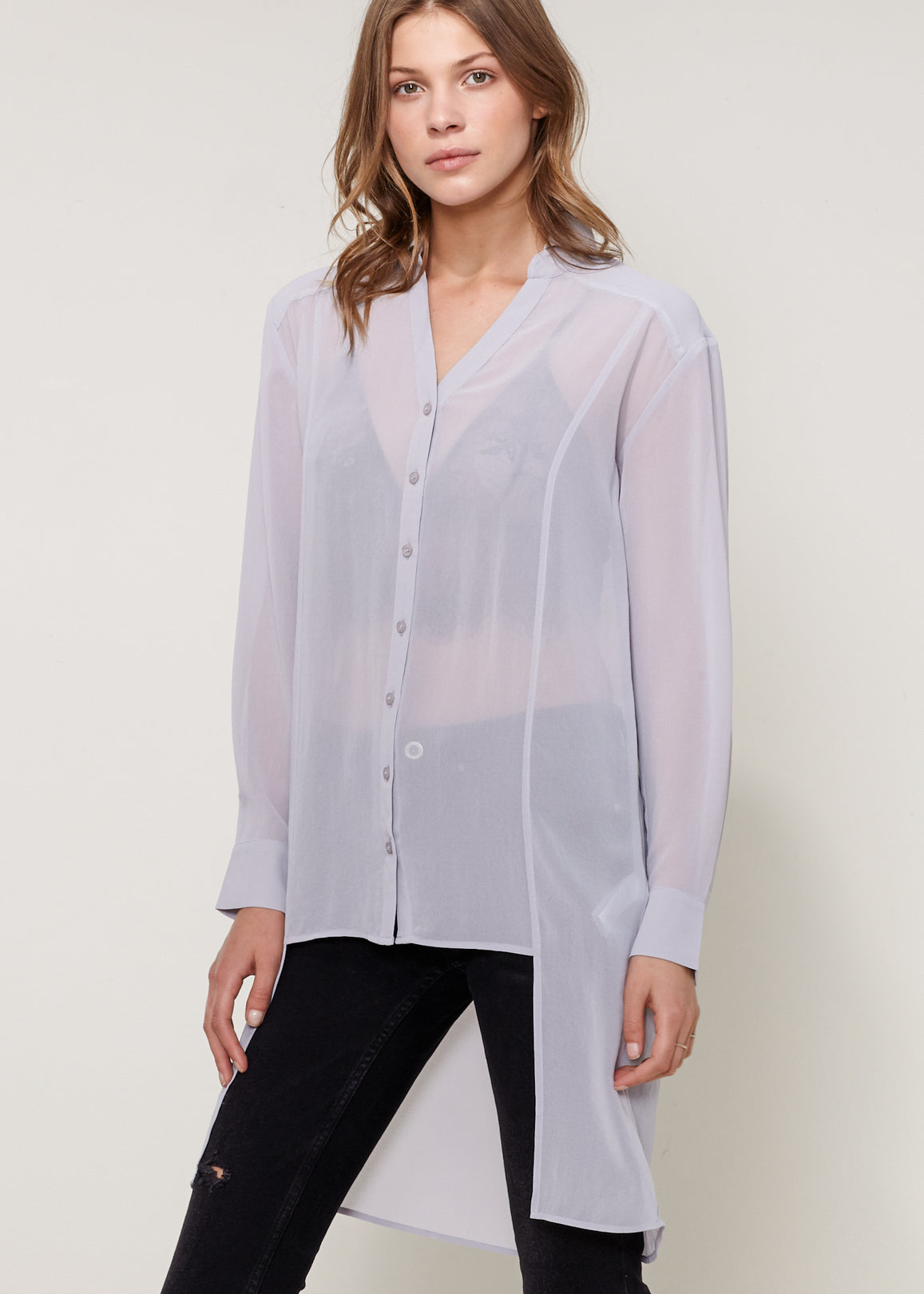 Women's Casual Sheer Hi-Lo Blouse featuring O-ring accent and hi-lo hem design, made from 100% polyester.