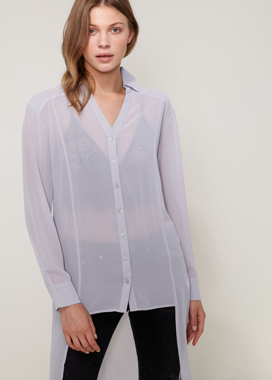 Women's Casual Sheer Hi-Lo Blouse featuring O-ring accent and hi-lo hem design, made from 100% polyester.