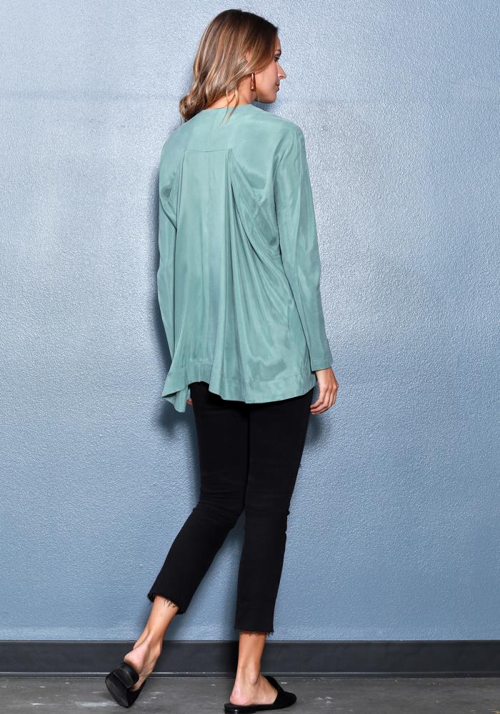 Women's Crewneck Hi-Lo Flared Hem Top featuring a silky fabric, crewneck, and gathered back design.