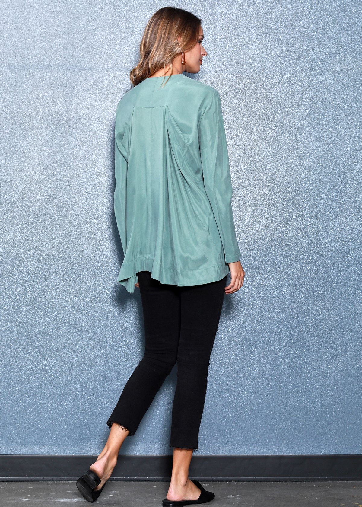 Women's Crewneck Hi-lo Top in Sage featuring a flared hem and hidden shoulder zipper, showcasing a stylish and comfortable design.