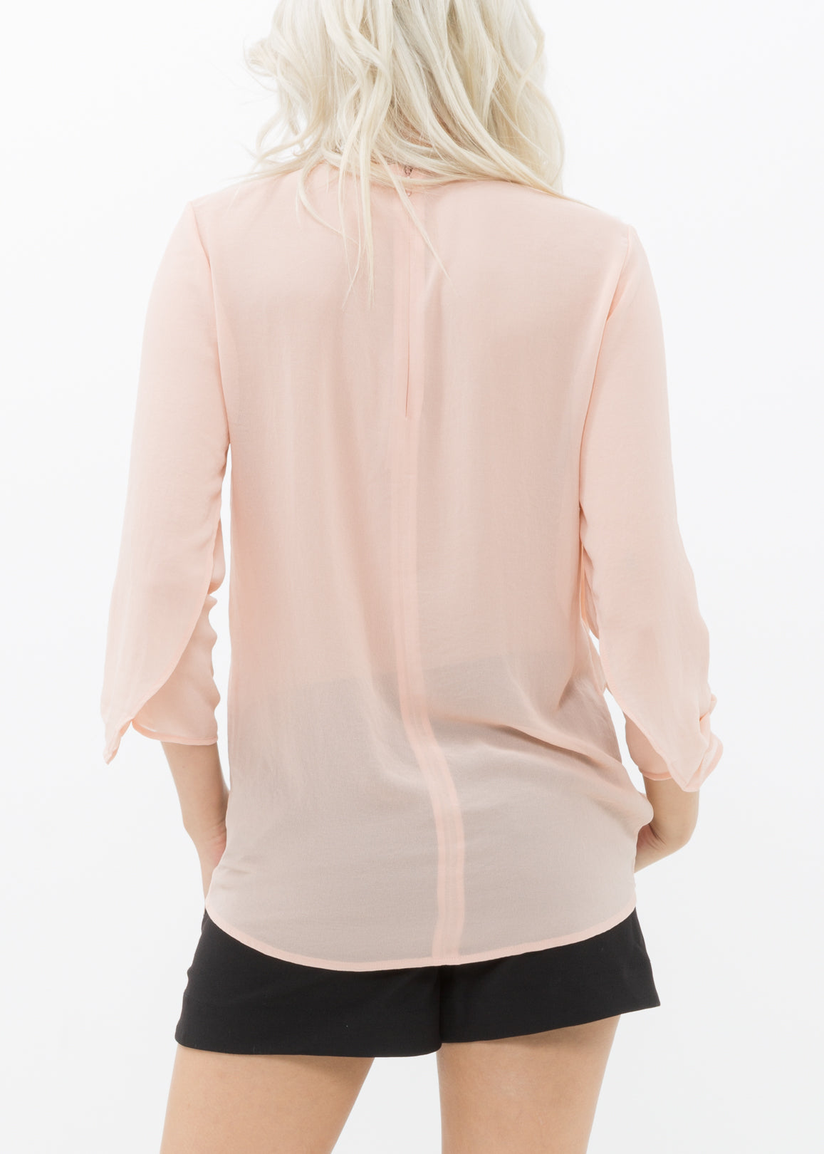 Women's Cross Hem Blouse featuring a surplice hem and gathered cuff details, made from lightweight polyester.