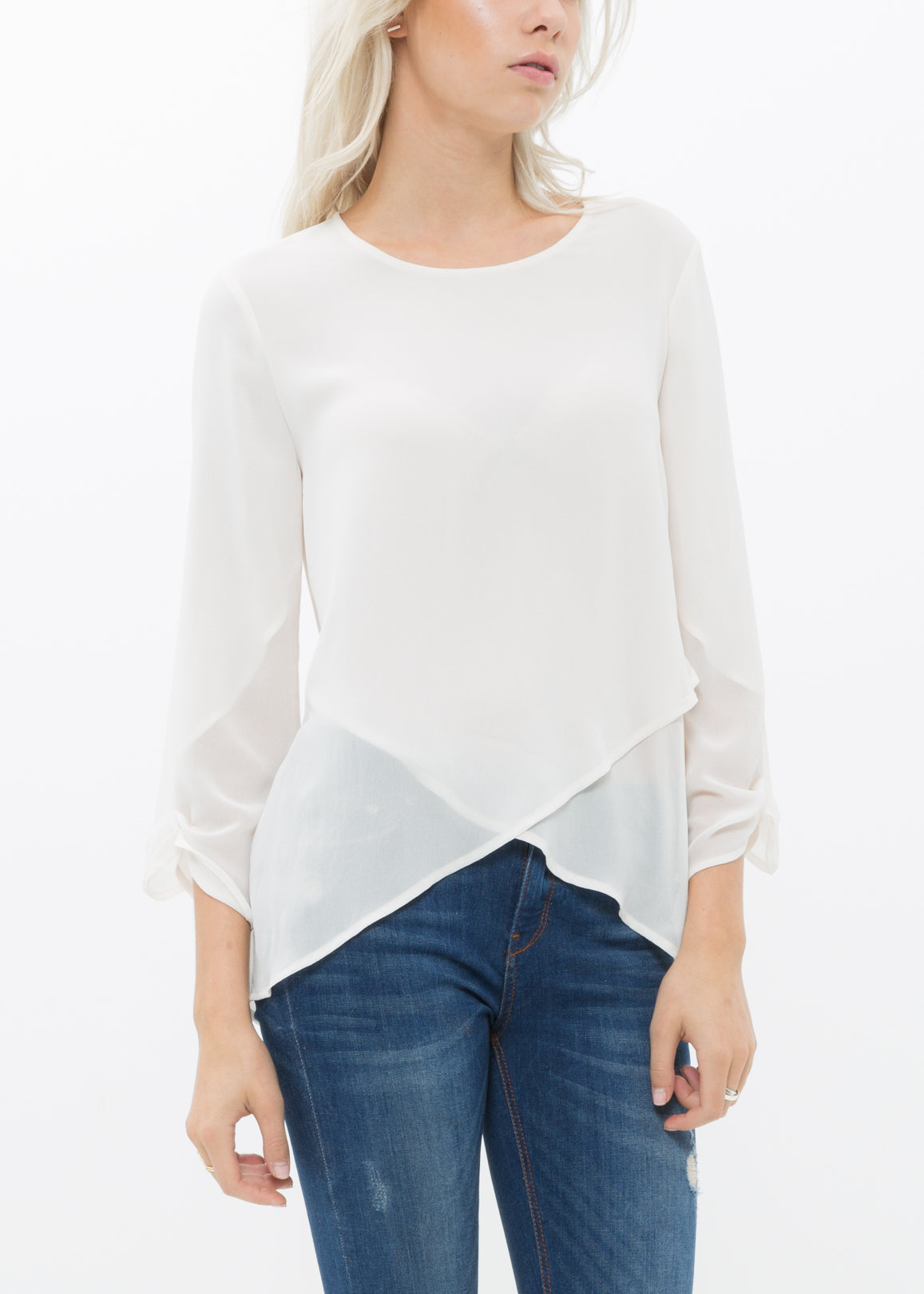 Women's Cross Hem Blouse featuring a surplice hem and gathered cuff details, made from lightweight polyester.