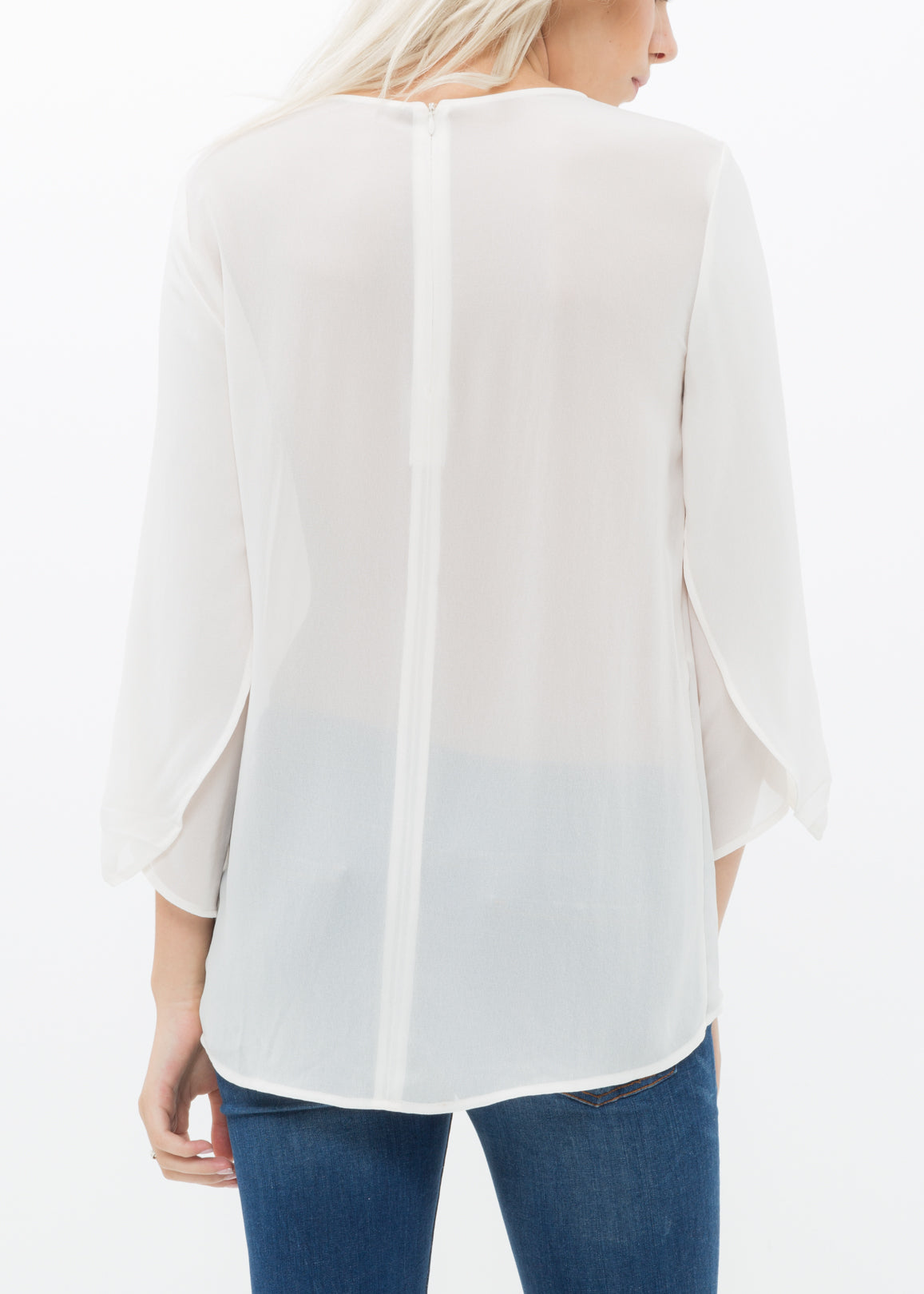 Women's Cross Hem Blouse featuring a surplice hem and gathered cuff details, made from lightweight polyester.